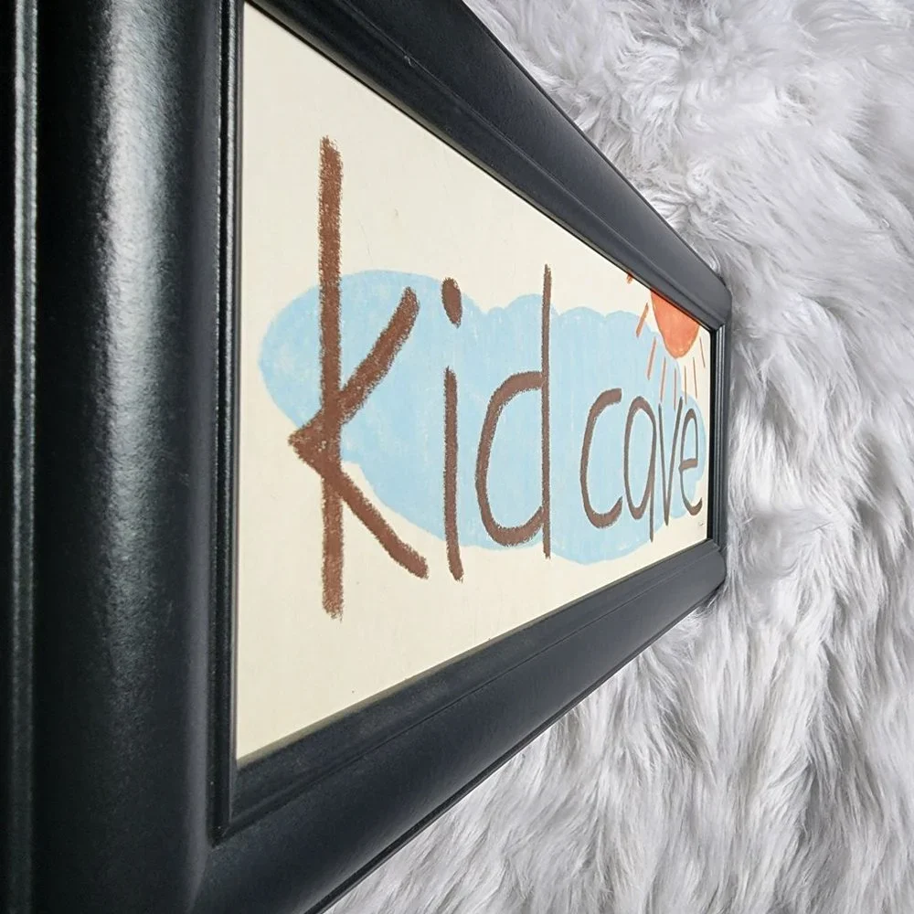 Lauren Rader Kid‎ Cave black framed art print with sun & cloud